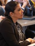 Suzan Somo in profile, seated