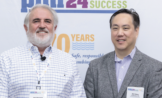 Bob Bowcock with Will Wang in front of PMI backdrop