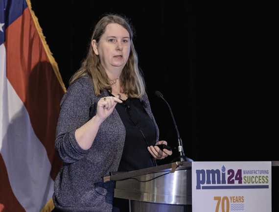 Katherine Zitsch speaking at a podium